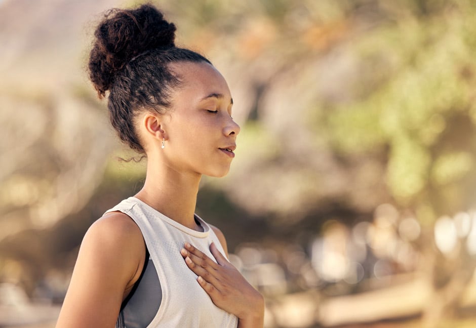 Woman meditating to achieve perfectionism